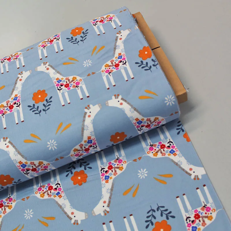 Dressmaking Fabric - Pale Blue Corduroy with Kissing Giraffes