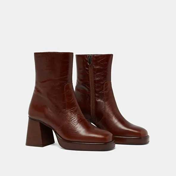 Platform ankle boots in brown distressed leather