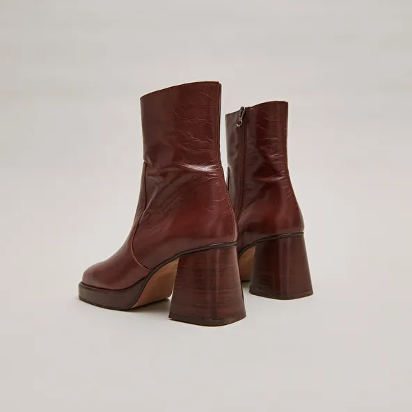 Platform ankle boots in brown distressed leather