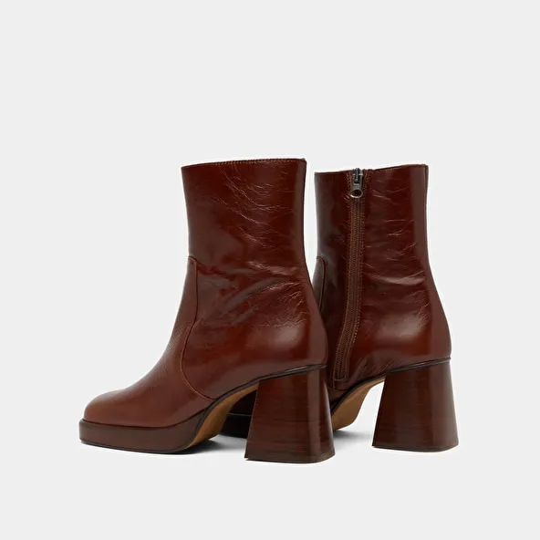 Platform ankle boots in brown distressed leather