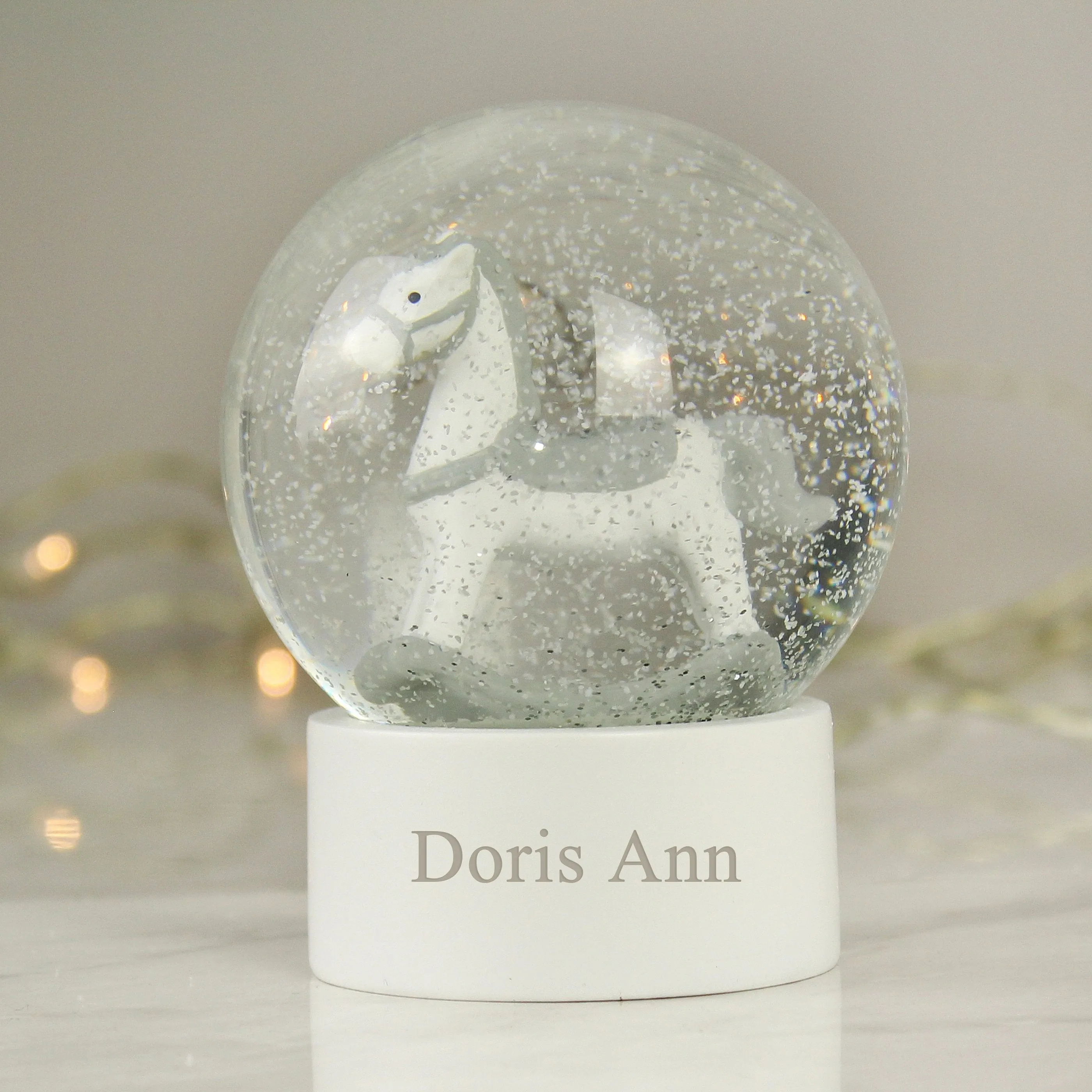 Rocking Horse Snow Globe with Personalized Name and Glitter.