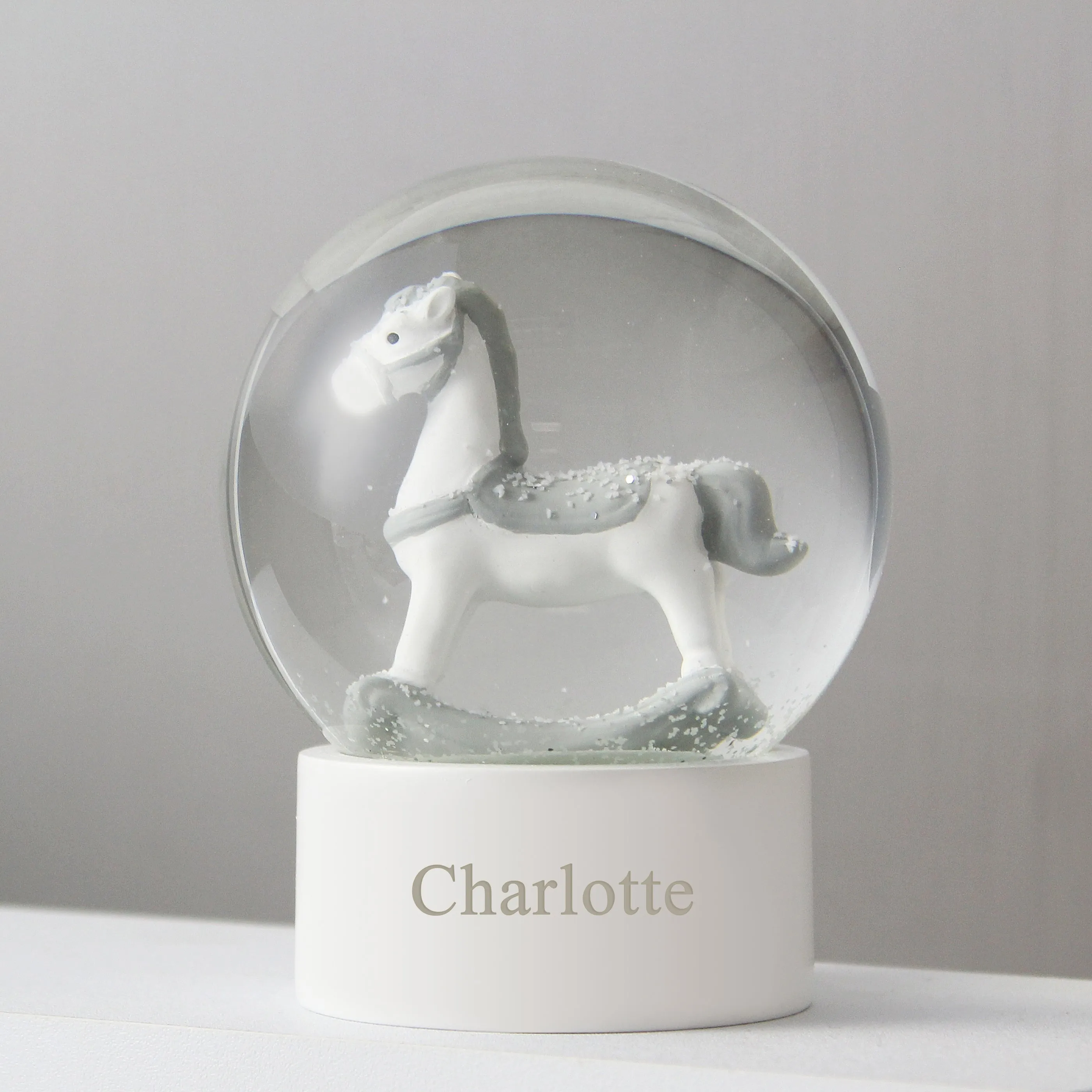 Rocking Horse Snow Globe with Personalized Name and Glitter.