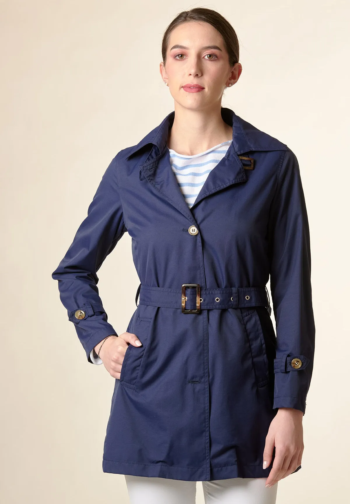 Technical blue trench coat with belt.