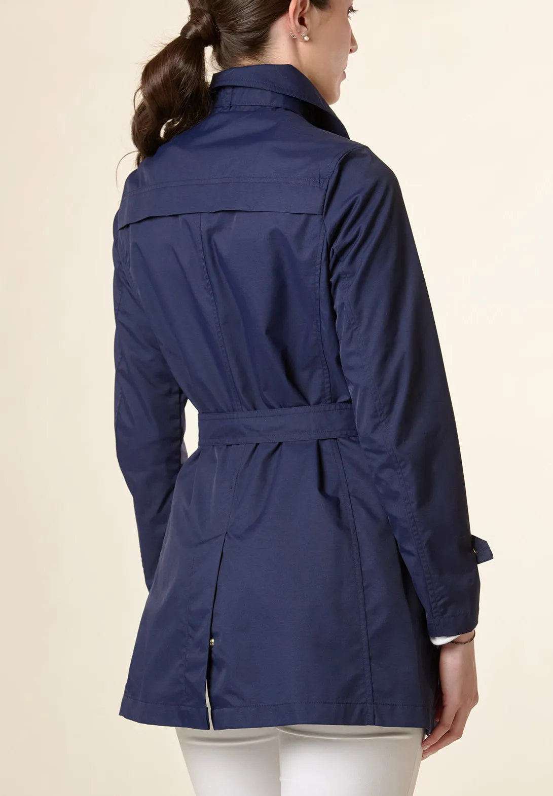 Technical blue trench coat with belt.