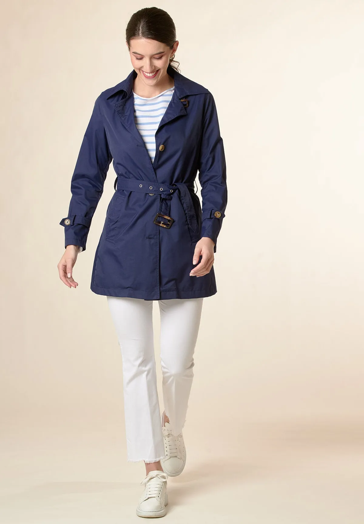 Technical blue trench coat with belt.