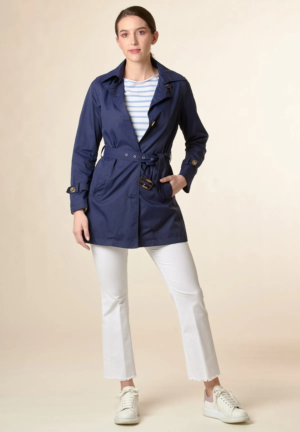 Technical blue trench coat with belt.