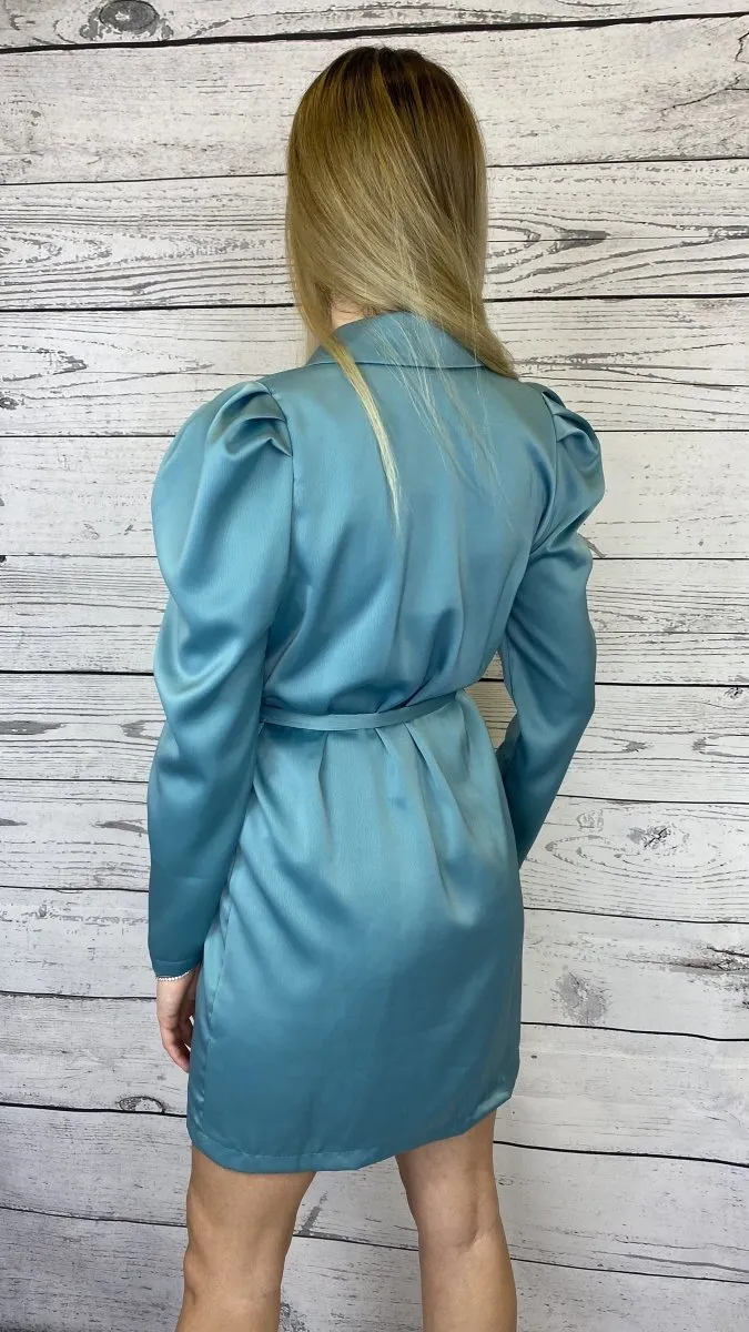 Turquoise trench coat with silver buttons.